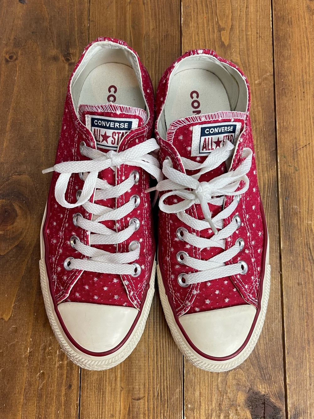 Converse women’s size 8 red with white star cutouts low top sneakers